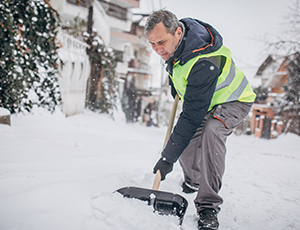 Man shoveling sidewalk